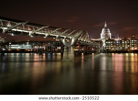 Millennium Bridge and St. Paul's Cathedral in London, UK. Royalty-Free Stock Photo #2510522