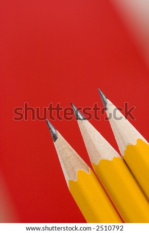 pencil on red background