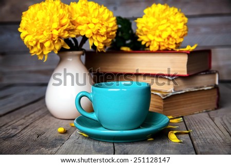 Flowers. Beautiful yellow chrysanthemum in a vintage vase. Cup of coffee. Bright Servais, cup and saucer .. Beautiful breakfast.