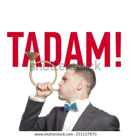 Funny man in blue bow tie blowing into the trumpet with title 'tadam'