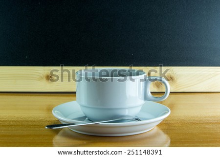 Still life cup of coffee on wooden table.