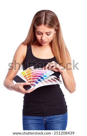 Young girl holding color swatch, isolated on white background