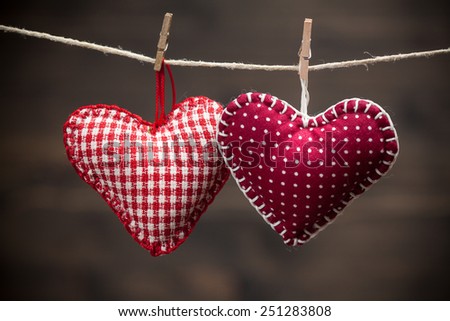 Colorful fabric hearts on wood backgrounds. Valentine's Love concept