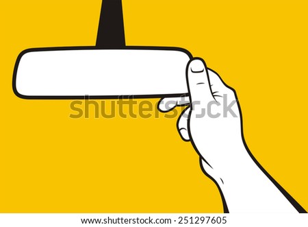 Hand adjusting rear-view mirror Royalty-Free Stock Photo #251297605