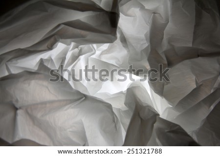 Abstract background of the insides of a white plastic bag with different color shades