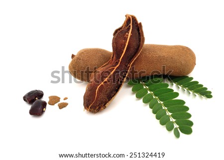 Tamarind and leaves on isolated white background Royalty-Free Stock Photo #251324419