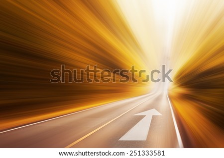 Conceptual image of asphalt road and direction arrow Royalty-Free Stock Photo #251333581