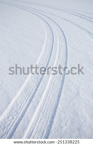 car track on snowy ground