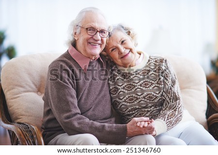 Affectionate couple in casualwear having rest at home Royalty-Free Stock Photo #251346760