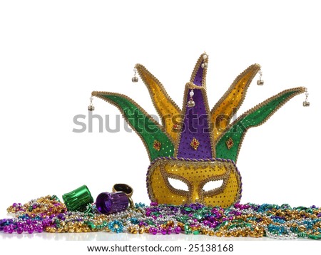 A group of mardi gras beads an mask with copy space