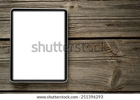     Save to a Lightbox ?              Find Similar Images     Share ?      Digital tablet computer with isolated screen on old wooden background 