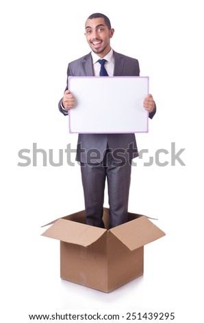 Businessman standing in the box isolated on white