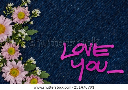 Love you free hand style with flowers on deep blue fabric background