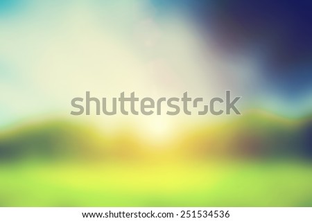 Defocused image, blur of fresh green spring summer landscape with sun shining. Royalty-Free Stock Photo #251534536