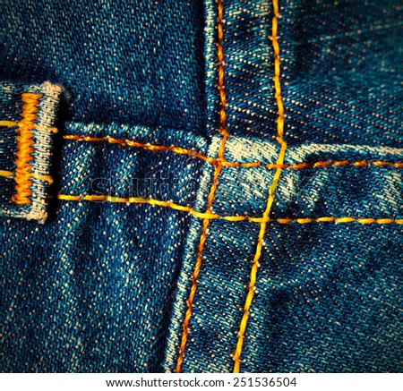old denim surface with seams, close up. instagram image retro style