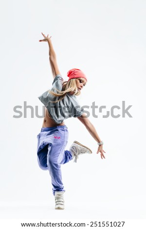 young beautiful dancer jumping on a studio background Royalty-Free Stock Photo #251551027