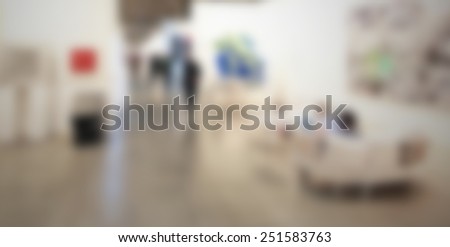 Art gallery background. Intentionally blurred editing post production. Location, people and works not recognizable.