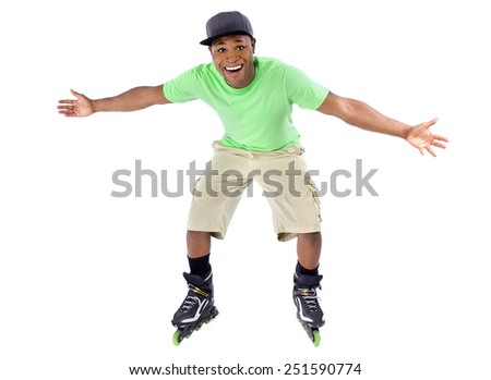 young adult black man balancing on rollerblade skates