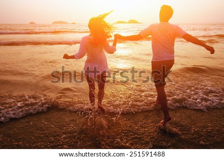 silhouette of couple on the beach, dream vacations Royalty-Free Stock Photo #251591488