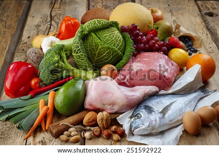 Various Paleo diet products on wooden table Royalty-Free Stock Photo #251592922