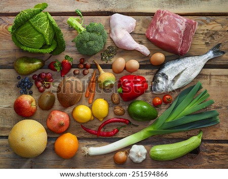 Various Paleo diet products on wooden table, top view Royalty-Free Stock Photo #251594866