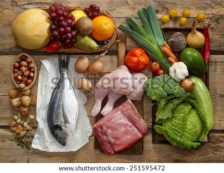 Various Paleo diet products on wooden table, top view Royalty-Free Stock Photo #251595472