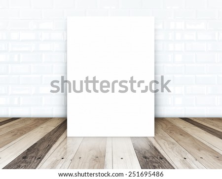 Blank paper poster on white ceramic tiles wall and tropical wood floor,template for your content