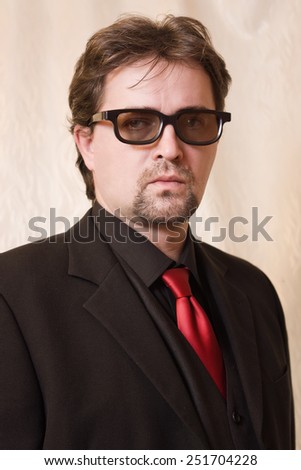 Portrait of the business man in a black