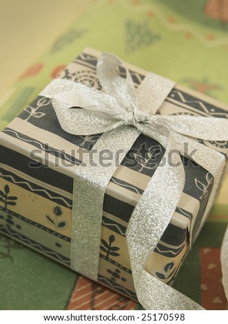 Closeup of gifts wrapped in elegant ribbons.