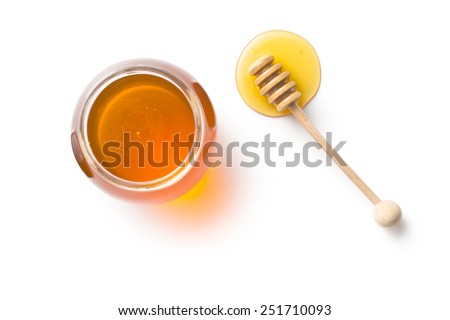 honey dipper and honey in jar on white background Royalty-Free Stock Photo #251710093