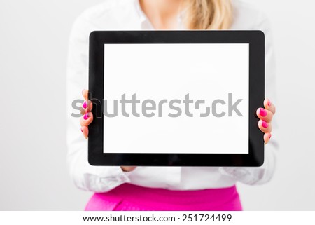 Business woman showing blank screen of tablet computer