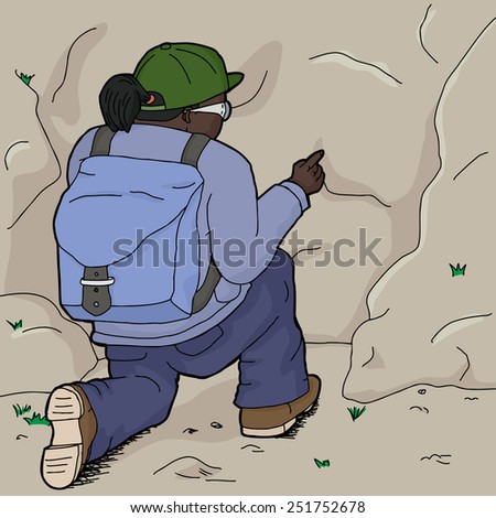 Rear view of female hiker pointing at rock