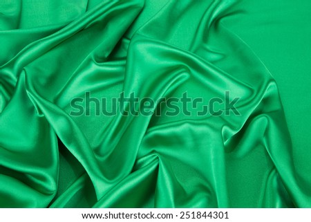 Green drapery silk fabric. Can be used as background.