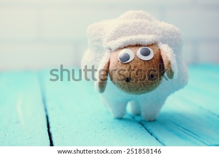  Little white lamb handmade on a wooden board blue
