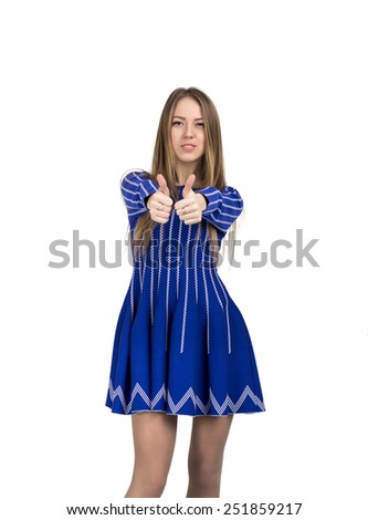 Happy smiling young lady with OK hand sign. Portrait of young Caucasian lady makes OK hand sign with both hands stretched forward. Bright casual dress and white background