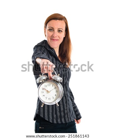 Business woman holding vintage clock 