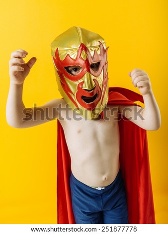 Photograph of a 4 year-old dressed as a Mexican wrestler or Luchador. 