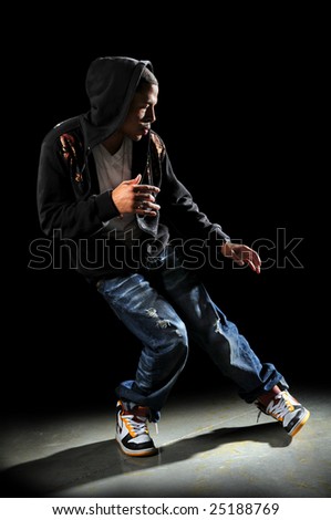 Hip hop dancer performing with strong directional light