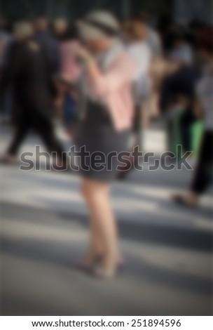 Blurred woman. Intentionally blurred editing post production. Humans not recognizable.