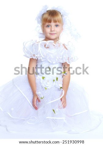 Beautiful little girl in a long white princess ball gown.Isolated on white background, Lotus Children's Center.
