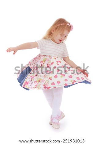 Beautiful little girl spinning around him.Isolated on white background, Lotus Children's Center.