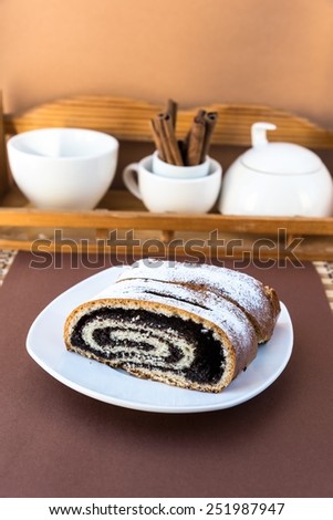 Sweet roll with poppy seeds on the plate