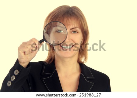 business woman holding magnifier