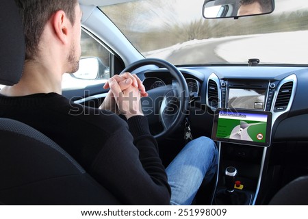 A man in a Autonomous driving  test vehicle Royalty-Free Stock Photo #251998009