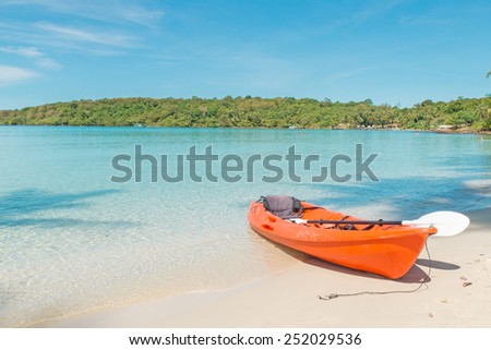Summer, Travel, Vacation and Holiday concept - Orange kayaks on the tropical beach, Thailand