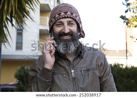 bearded man with mobile phone