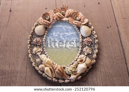 Frame picture made from shells. seas in the frame.