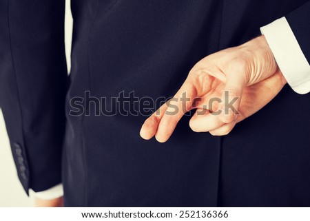 bright picture of man with crossed fingers Royalty-Free Stock Photo #252136366