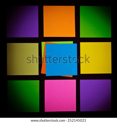 colored stickers on a black background