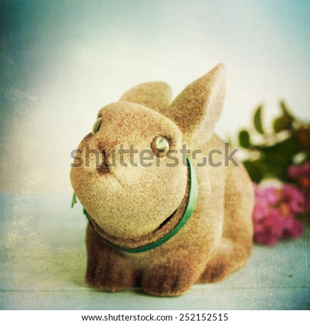 Cute rabbit with spring flowers